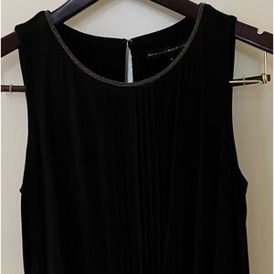 WHBM long black knit top. Pleated front with shimmery neck. Size M